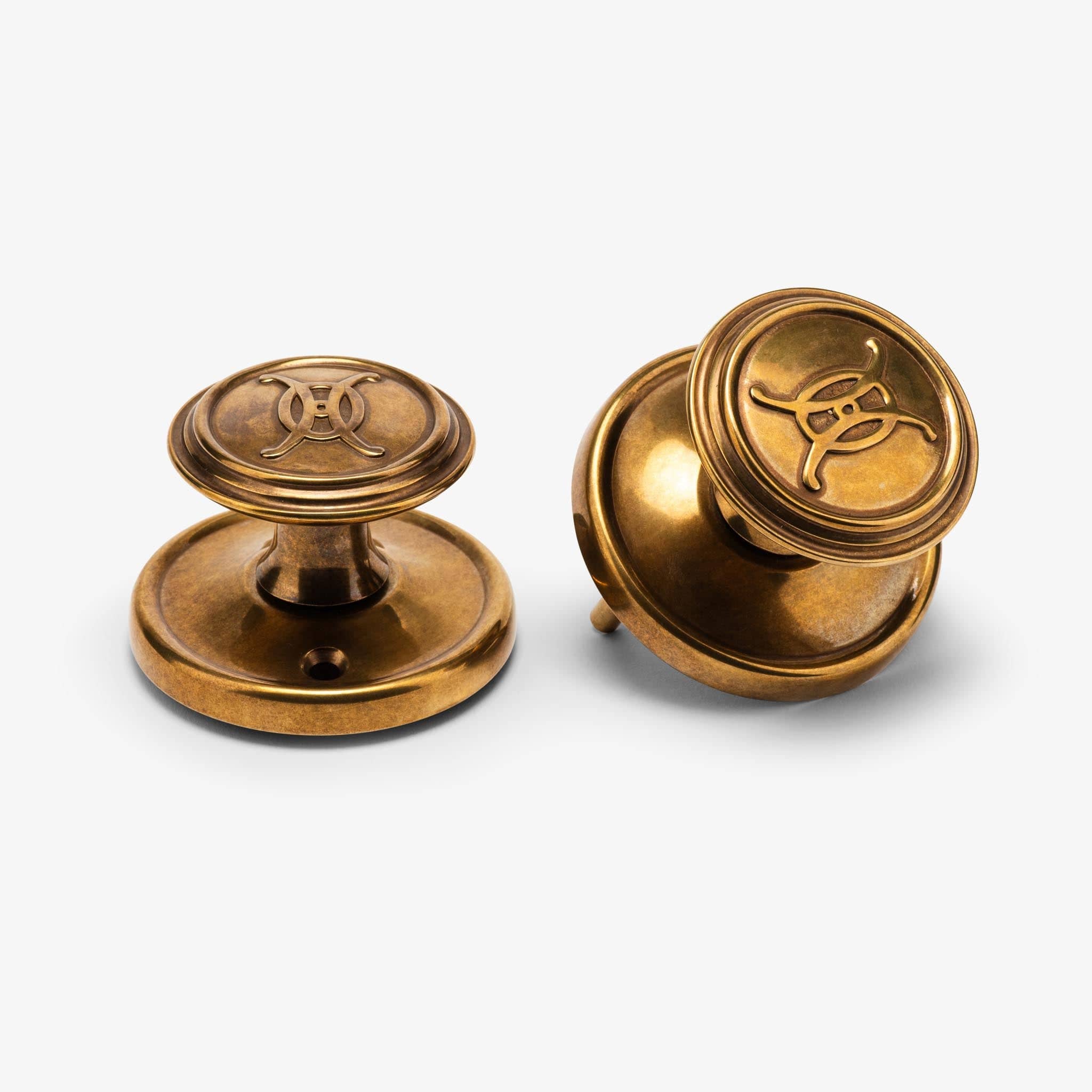 Valencia Logo Passage Door Knob Set - Burnished Brass