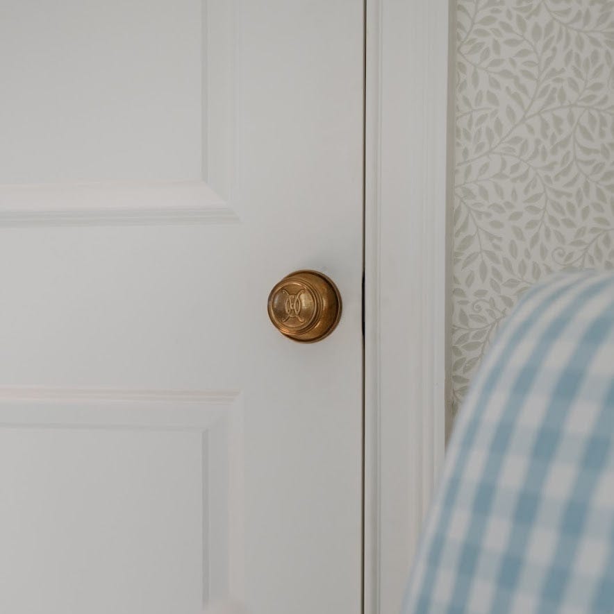 Valencia Logo Passage Door Knob Set - Burnished Brass