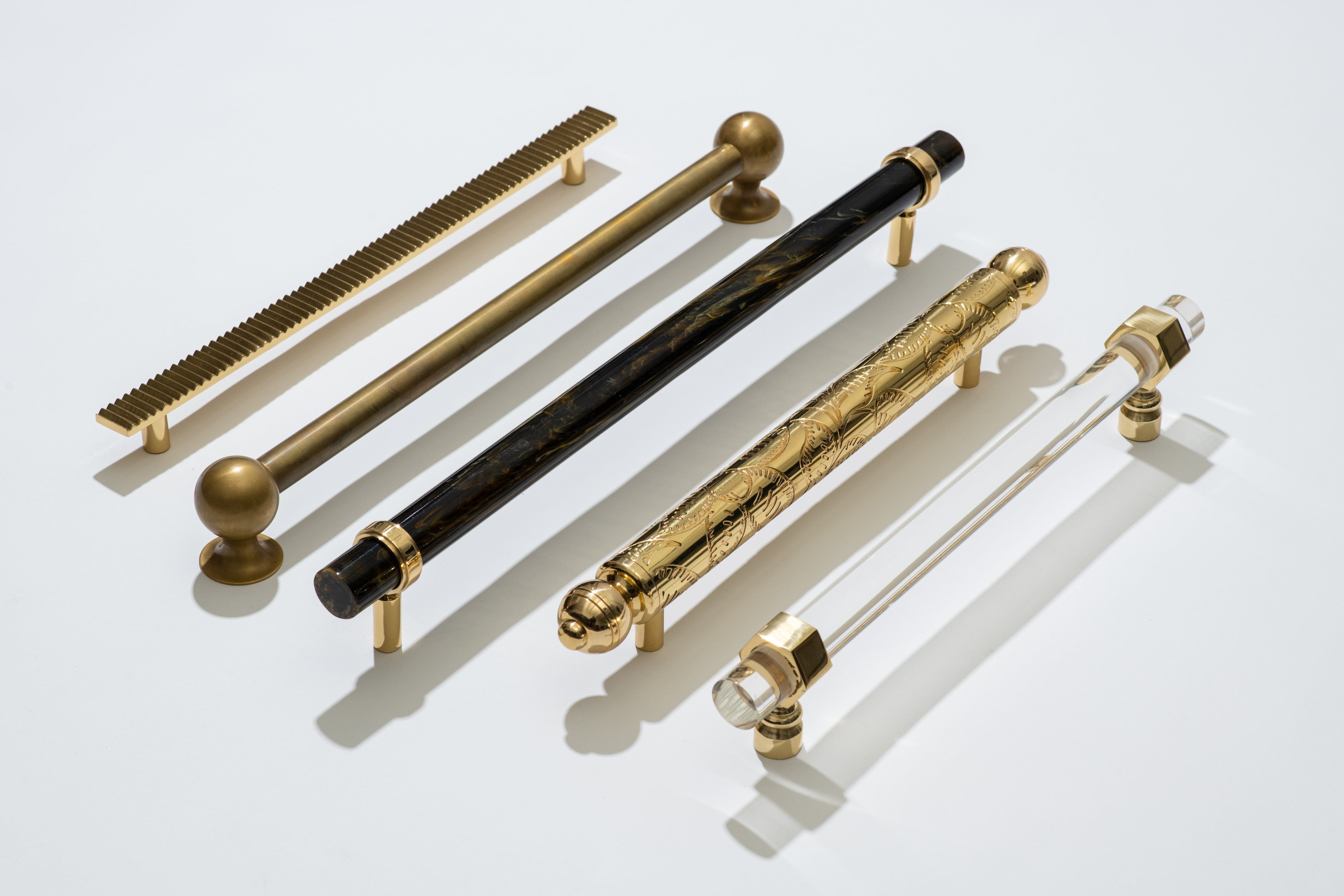 From left to right. Allen 14" Appliance Pull , Cosmos 16.50" Appliance Pull , Edgewood 18" Tortoise Appliance Pull , Moroccan Bar Pull , Middleton 14" Appliance Bar Pull