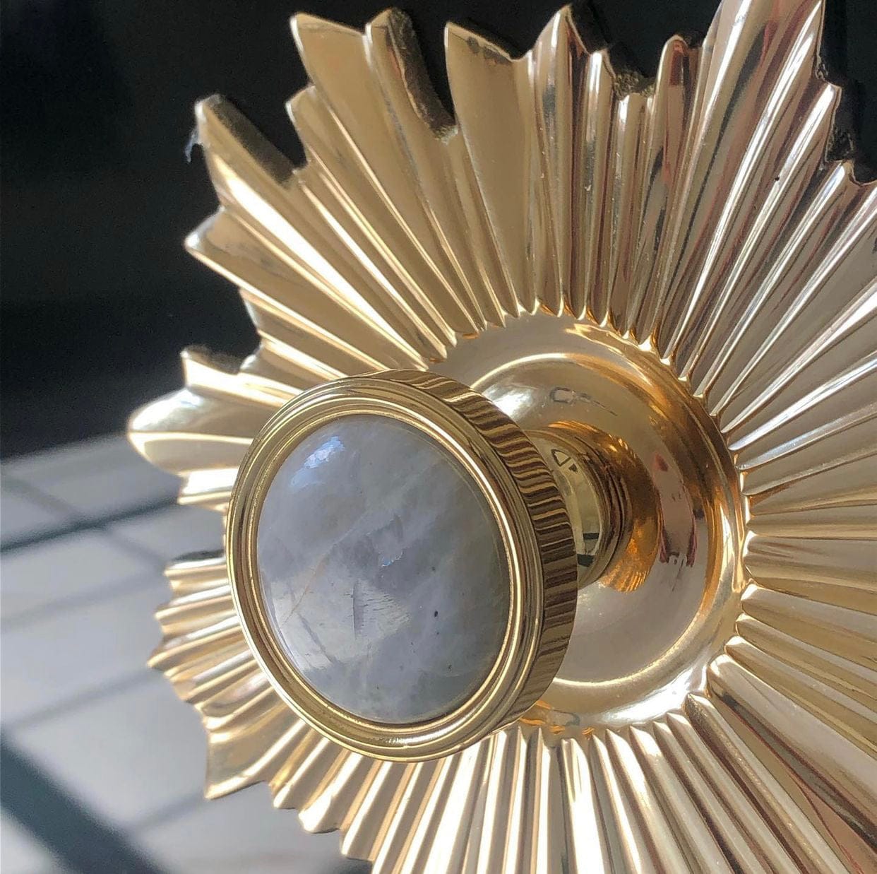 Lane Knob in Brass with Moonstone and Starburst Backplate