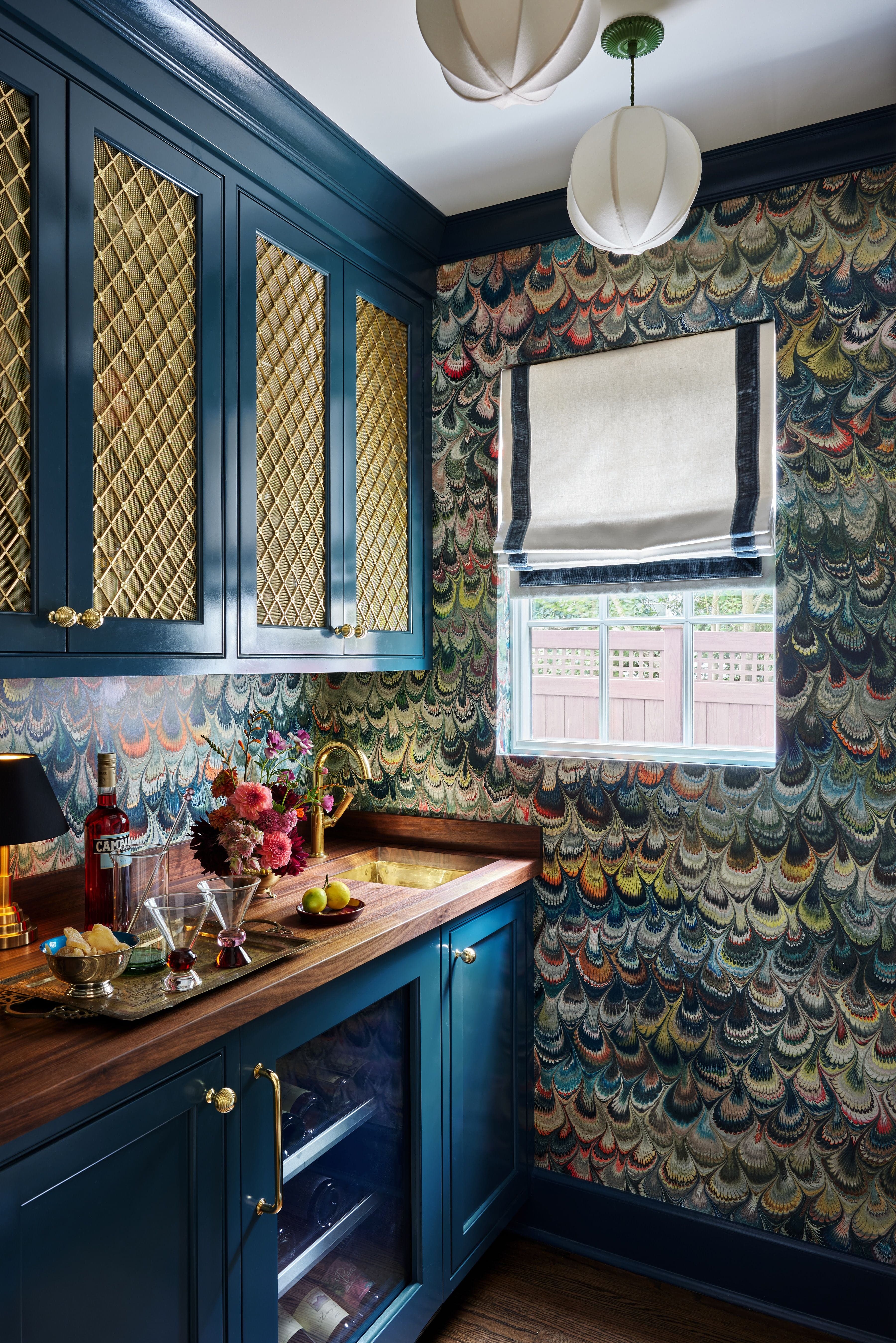 2. Polished Brass and Colored Cabinets