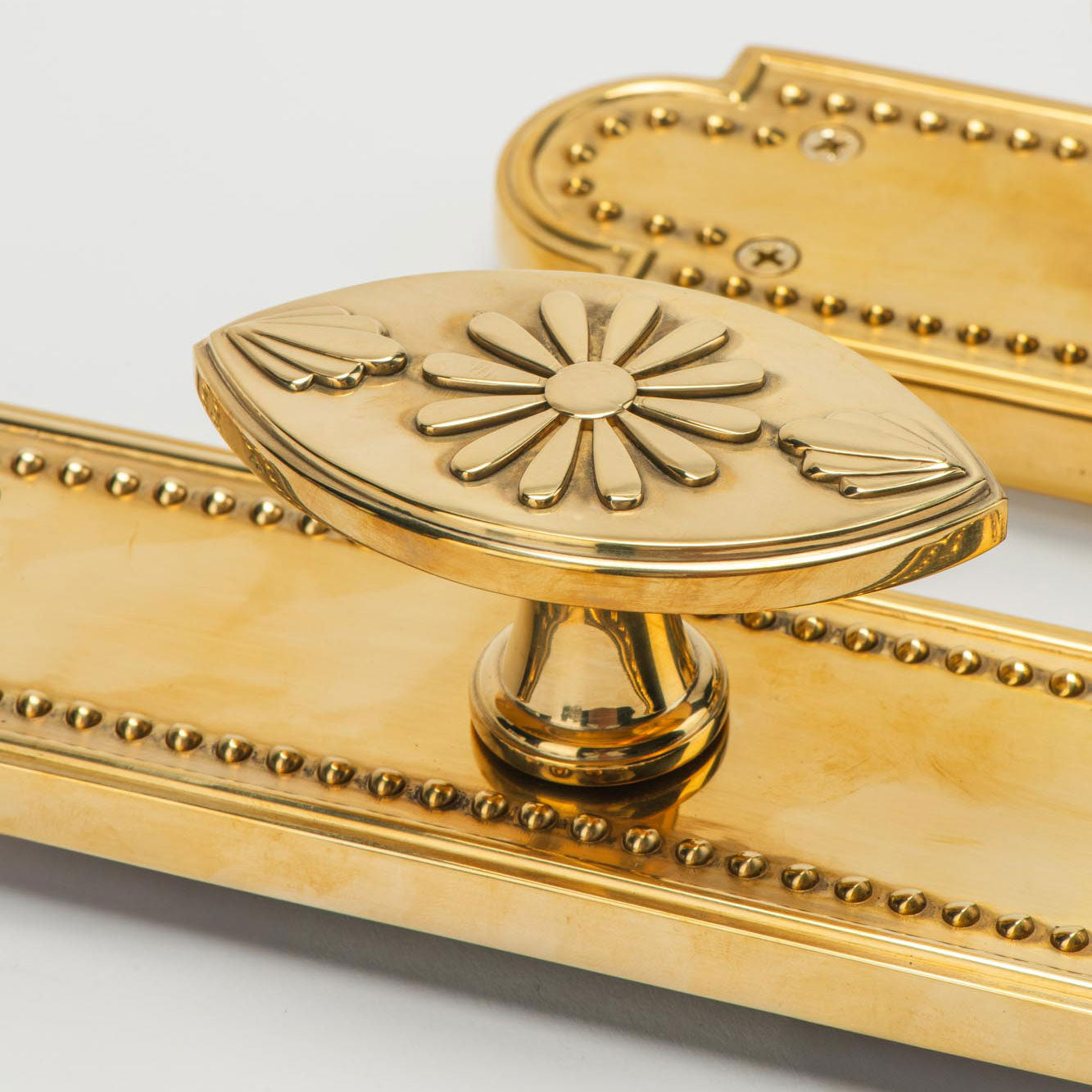 Rosalie Vertical Passage Door Knob Set in Unlacquered Brass